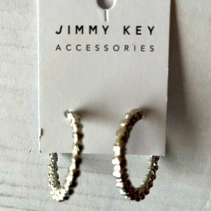 New Jimmy Key designed silver round shape earrings .